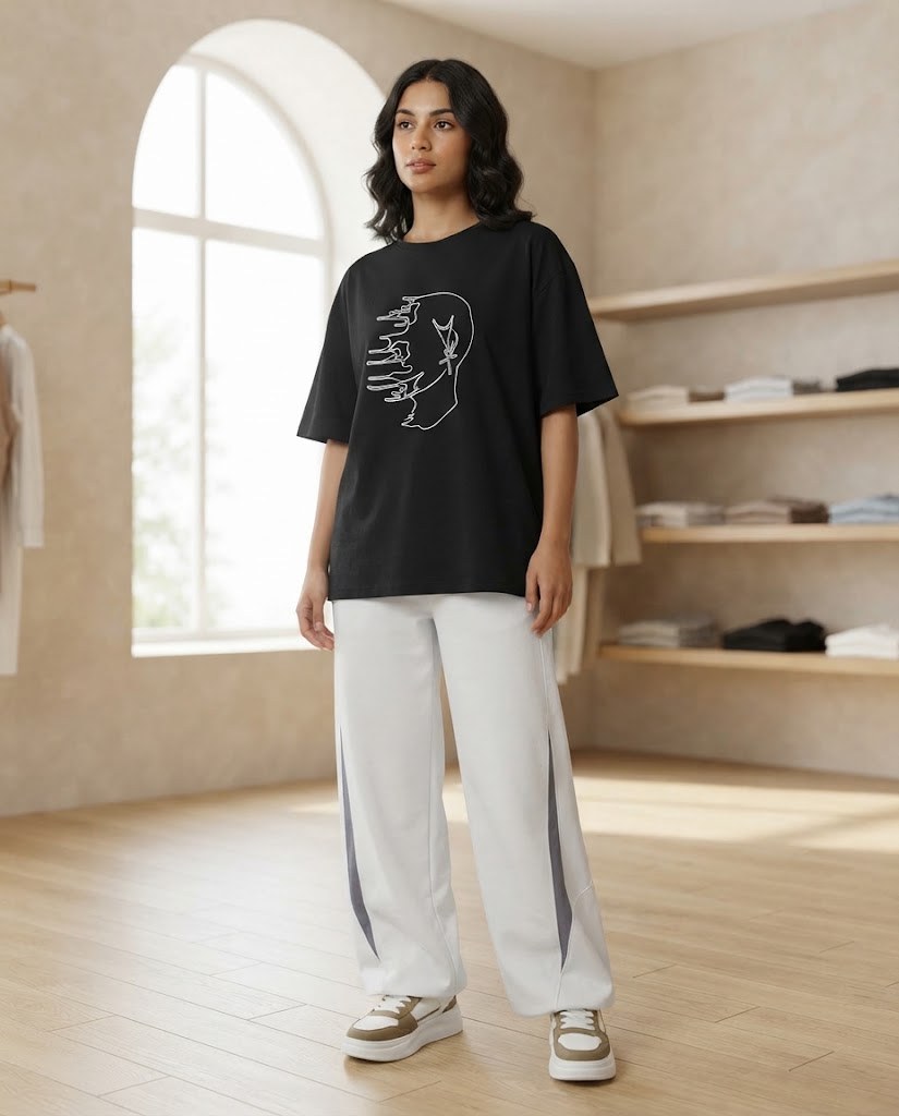 Model wearing the black oversized t-shirt with line-art print – the photo was created with AI; the item itself is a real product from our store