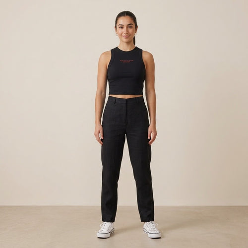Model wearing a black cropped tank top