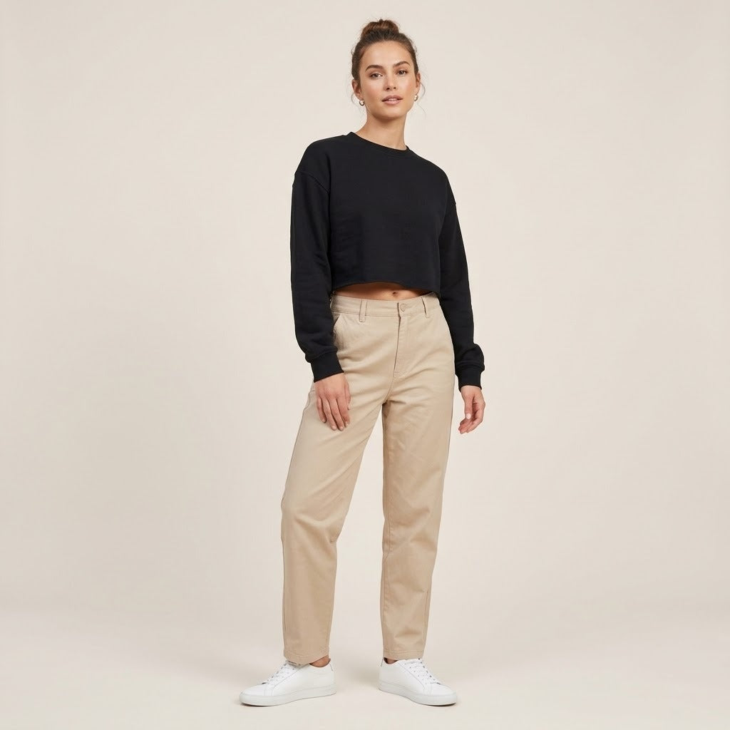 Model wearing a black cropped crewneck sweatshirt