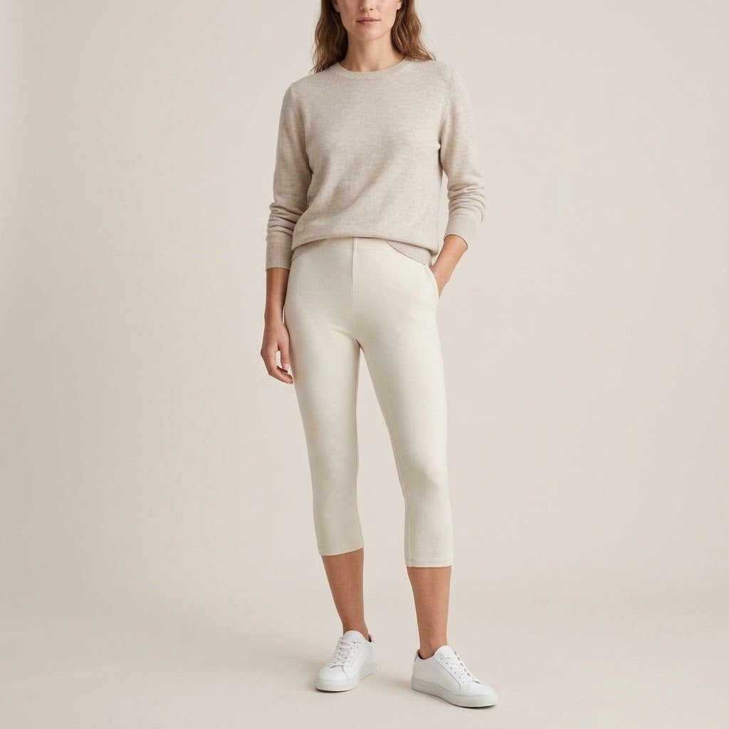 Model wearing cream capri leggings