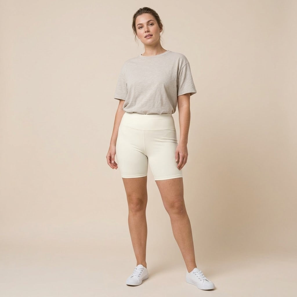 Model wearing cream bike shorts