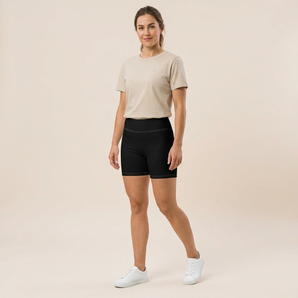 Model wearing black active shorts