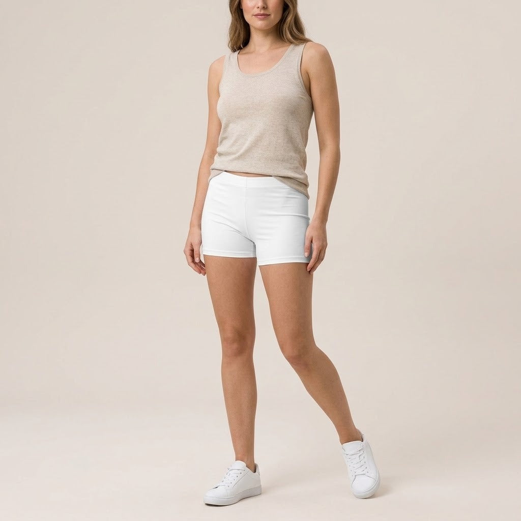 Model wearing white active shorts